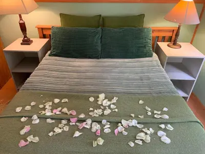 a bed with a bunch of shells on it at The Farmhouse B&B in Stellenbosch