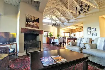 a living room with a couch and a table at Lagoon View in Hermanus in Hermanus