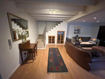 a living room with a couch and a table at Paradyskloof Suite in Stellenbosch