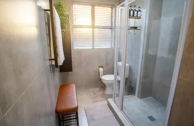 a bathroom with a shower and a toilet at Century City Luxury 2 bedroom apartment in Cape Town in Cape Town