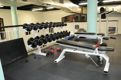 a gym with a rack of dumbbells at Century City Luxury 2 bedroom apartment in Cape Town in Cape Town