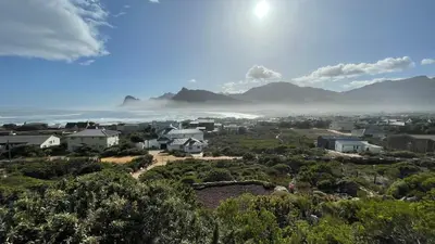 a view of a city with mountains in the background at The Butterfly Villa in Pringle Bay
