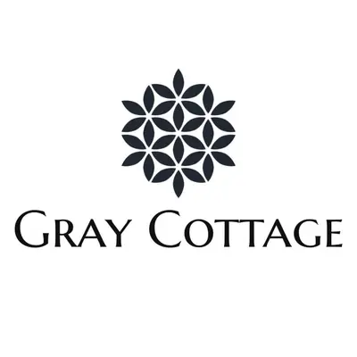 a black and white logo for gray conference at Gray Cottage in Strand