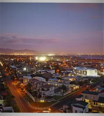 a view of a city at night with lights at Blouberg,1106 Portico,Cape town in Cape Town