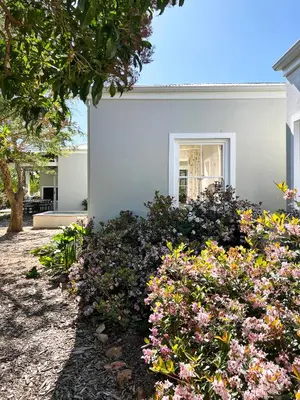 a garden of flowers in front of a house at La Belle Vie in Franschhoek