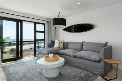 a living room with a couch and a table at Burmeister on Park Apartments in Cape Town