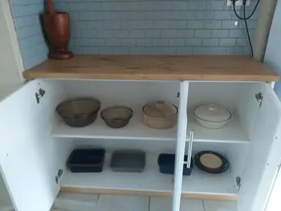a shelf with bowls and other items on it at Prince Alfreds in Caledon