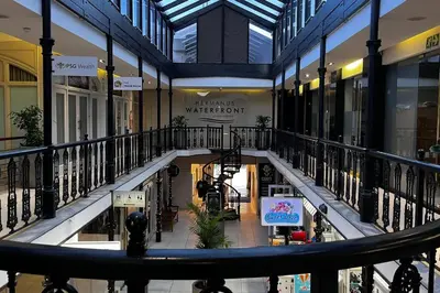 a view of a shopping mall from a balcony at Hermanus Waterfront Apartment No.19 in Hermanus