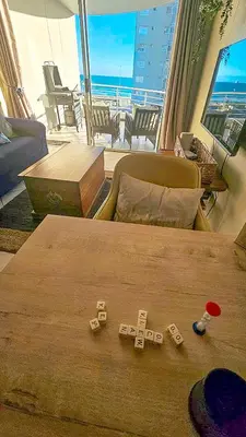 a room with a bed with dominoes on the floor at OCEAN VIEW, Blouberg Beach, Sunsets & Kite Beach in Bloubergstrand