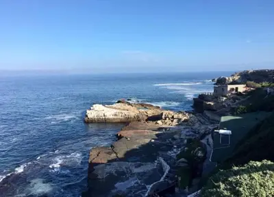 a house on a cliff next to the ocean at 2-Bedroom Hermanus - Sleeps 4 - Near Sea in Hermanus