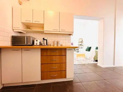 a kitchen with white cabinets and a counter top at 2-Bedroom Hermanus - Sleeps 4 - Near Sea in Hermanus