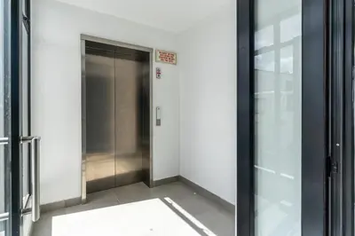 a hallway with an elevator in a building at Burmeister 607 - Top Floor Corner 2 Bedroom Apartment with Sea and Lagoon Views - Onsite Parking in Cape Town