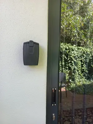 a black box on a wall next to a door at Lucano 1 Stellenbosch in Stellenbosch