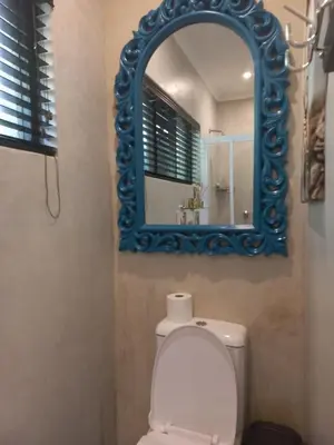 a bathroom with a mirror and a white toilet at Lucano 1 Stellenbosch in Stellenbosch