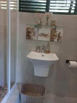 a bathroom with a white sink and a shower at Lucano 1 Stellenbosch in Stellenbosch
