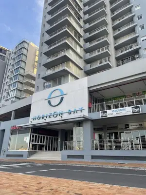 a building with aorenitz club sign in front of a building at 104 Horizon Bay Bloubergstrand in Bloubergstrand