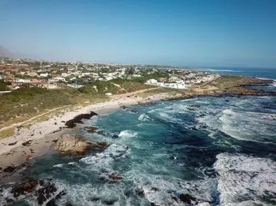 an aerial view of a beach with the ocean at Mountain and Sea Cottage in Hermanus