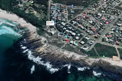 a map of a parking lot next to the ocean at Mountain and Sea Cottage in Hermanus