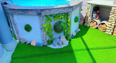 a garden themed birthday cake with a pool and a house at Kwaaami in Cape Town