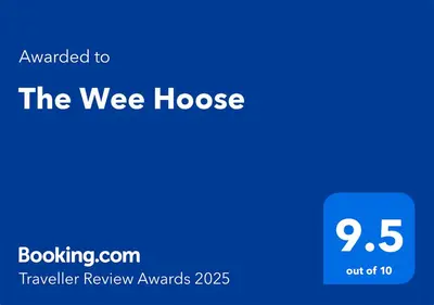 a blue sign that reads the wee house at The Wee Hoose in Strand