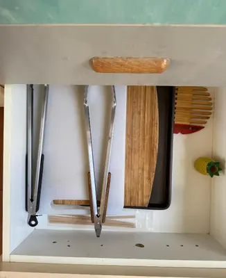a kitchen with wooden utensils hanging from the ceiling at Coastal House: 3BR+Private Entrance+Self catering in Cape Town