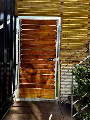 a wooden door on the side of a building at The Leopard Leaf Inn in Cape Town