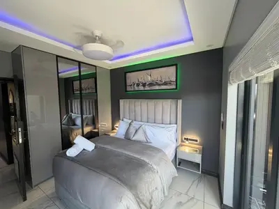 a bedroom with a large bed in a room at Exclusive Ultra-Luxury A Cut Above Apartments Century City by Vvip Bookings in Cape Town