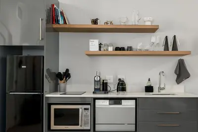 a kitchen with a refrigerator and a microwave at Luxury Winetram getaway in Franschhoek