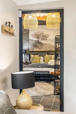 a living room with a bunk bed and a lamp at Avemore Time Out - full power back up in Stellenbosch