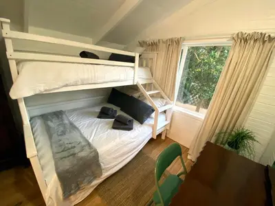 a bedroom with two bunk beds and a window at Prometheus in Lake Marina
