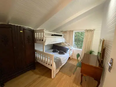 a bedroom with a bunk bed in a attic at Prometheus in Lake Marina