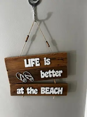 a sign that reads life is better at the beach at Beachside Bliss Strand in Strand