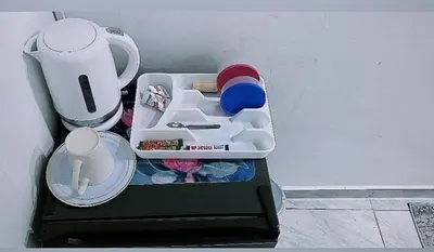 a small refrigerator with a tray with items in it at Blue Nile Guest in Cape Town