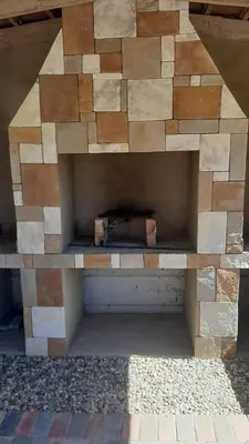 a stone fireplace sitting on top of avisor at Elim Rest Place in Fisherhaven