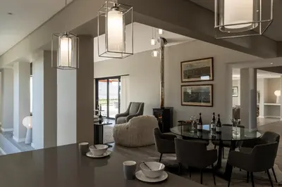 a dining room with a table and chairs at Benguela Cove - Utopia in Hermanus