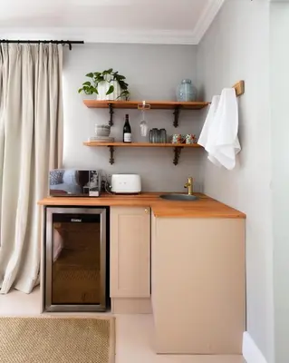 a small kitchen with a counter and a sink at The Belmont in Franschhoek