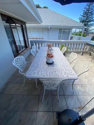 a white table and chairs on a patio at Somstuis in Hermanus
