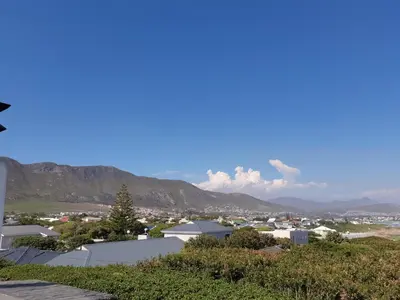 a view of a city with mountains in the background at Vermont Lofts in Hermanus