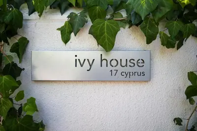 a sign that reads my house syyrs hanging on a wall at Ivy House - Super Spacious Spot- Somerset West in Somerset West