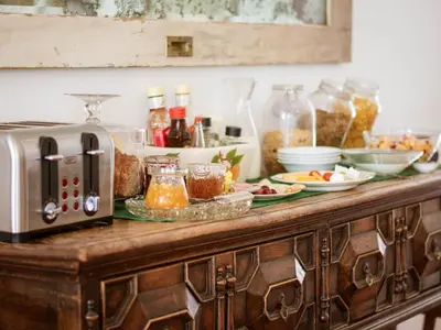a kitchen counter with a toaster and some food at Kolonie's Tuin in Stellenbosch