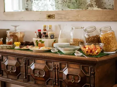 a wooden cabinet with food on top of it at Kolonie's Tuin in Stellenbosch