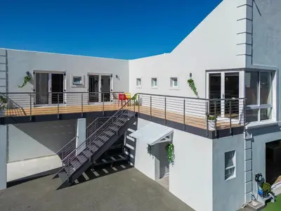 an aerial view of a house with a deck at Ocean Vibes in Cape Town