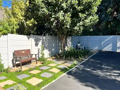 a bench sitting in a yard next to a fence at Ladamon 3 in Paarl