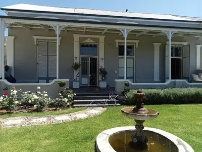 a house with a fountain in the front yard at Ladamon 3 in Paarl