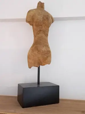 a statue of a woman on a stand on a table at La Damon 1 in Paarl