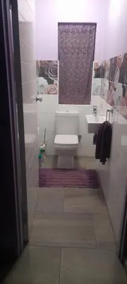 a bathroom with a toilet and a sink at S & V Accommodation in Cape Town