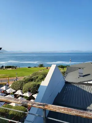 a view of the ocean from the balcony of a house at *Self-Check in - Whale Watching Paradise -Central* in Hermanus