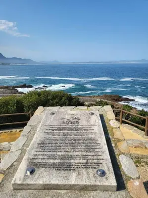 a monument on the beach with the ocean in the background at *Self-Check in - Whale Watching Paradise -Central* in Hermanus