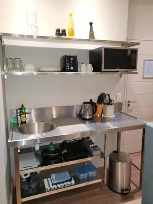 a kitchen counter with a sink and a microwave at *Self-Check in - Whale Watching Paradise -Central* in Hermanus