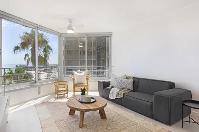 a living room with a couch and a table at Welgelegen 608 in Strand